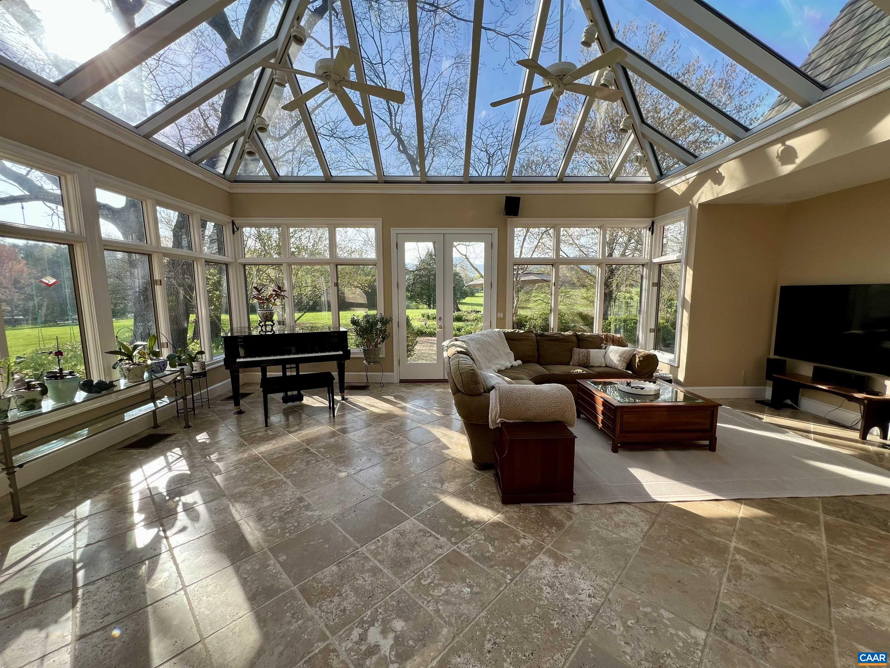 4749 Wesley Chapel Road Free Union, VA 22940 - Photo 31 of 73 a living room with furniture a large window and a flat screen tv