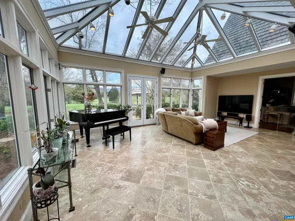 a bathroom with a double vanity sink a mirror and a shower