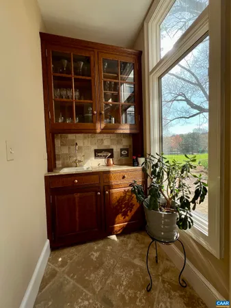 a bed sitting in a bedroom and fireplace