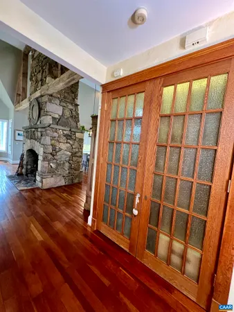 a bathroom with a tub sink and view of living room