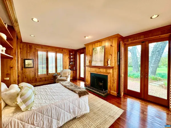 a bedroom with a bed couch and window