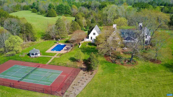 a view of a roof deck with lounge chairs