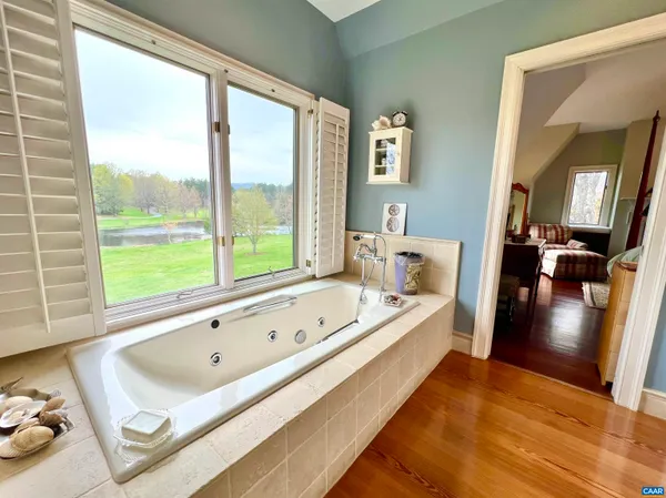 a view of a small house with a yard