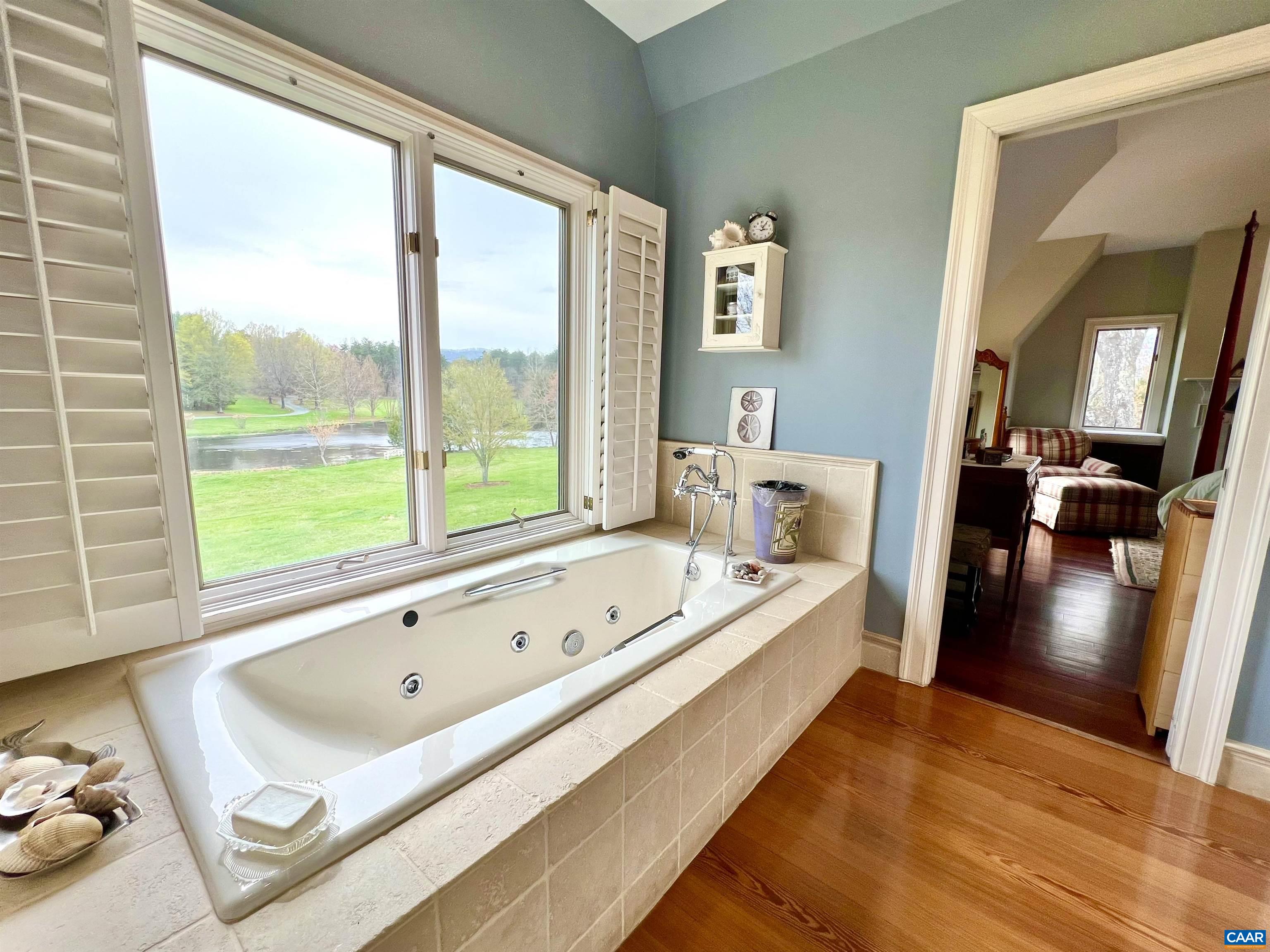 4749 Wesley Chapel Road Free Union, VA 22940 - Photo 47 of 73 a bathroom with a tub sink and view of living room
