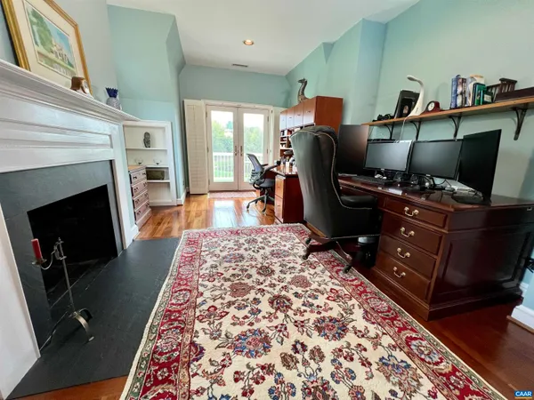 a view of a lake with houses in the background