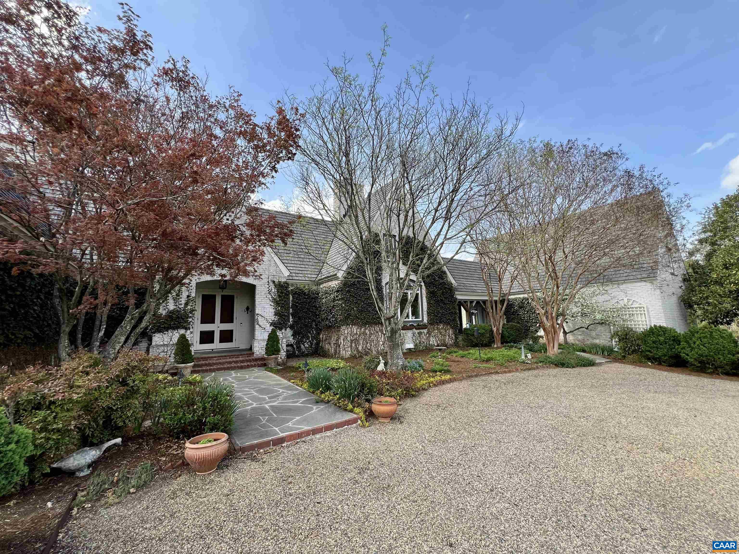 4749 Wesley Chapel Road Free Union, VA 22940 - Photo 9 of 73 a front view of a house with a yard and tree s