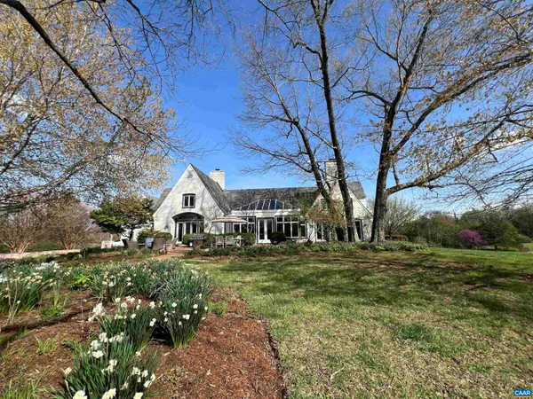 a large kitchen with kitchen island granite countertop a stove and wooden floor