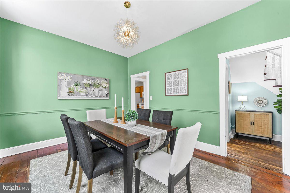204 Rutledge Avenue Folsom, PA 19033 - Photo 12 of 37 a view of a dining room with furniture wooden floor and a chandelier