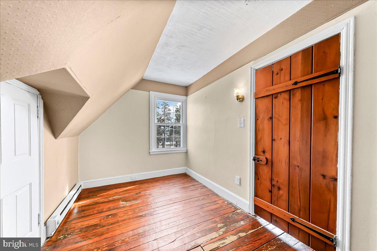 204 Rutledge Avenue Folsom, PA 19033 - Photo 28 of 37 a view of an entryway with wooden floor and door