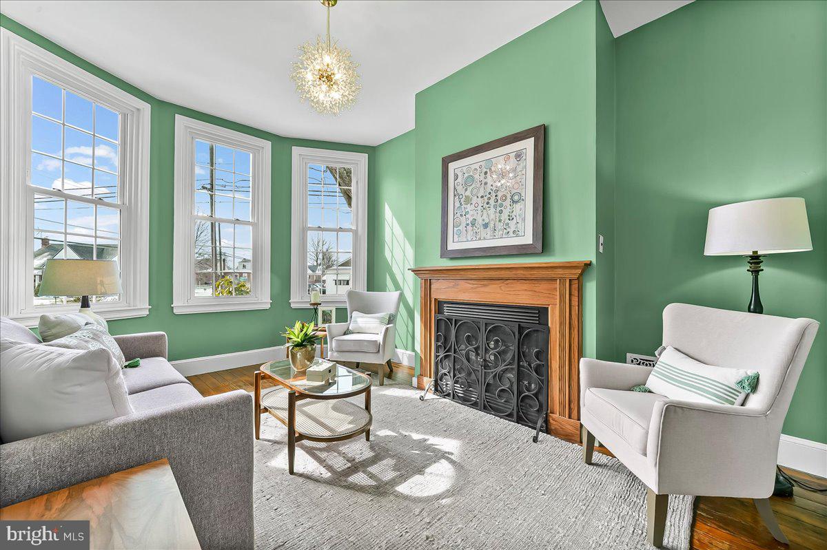 204 Rutledge Avenue Folsom, PA 19033 - Photo 8 of 37 a living room with furniture a window and a fireplace