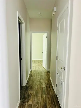 a view of a bathroom from a hallway