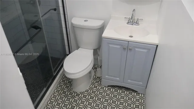 a bathroom with a toilet and a sink