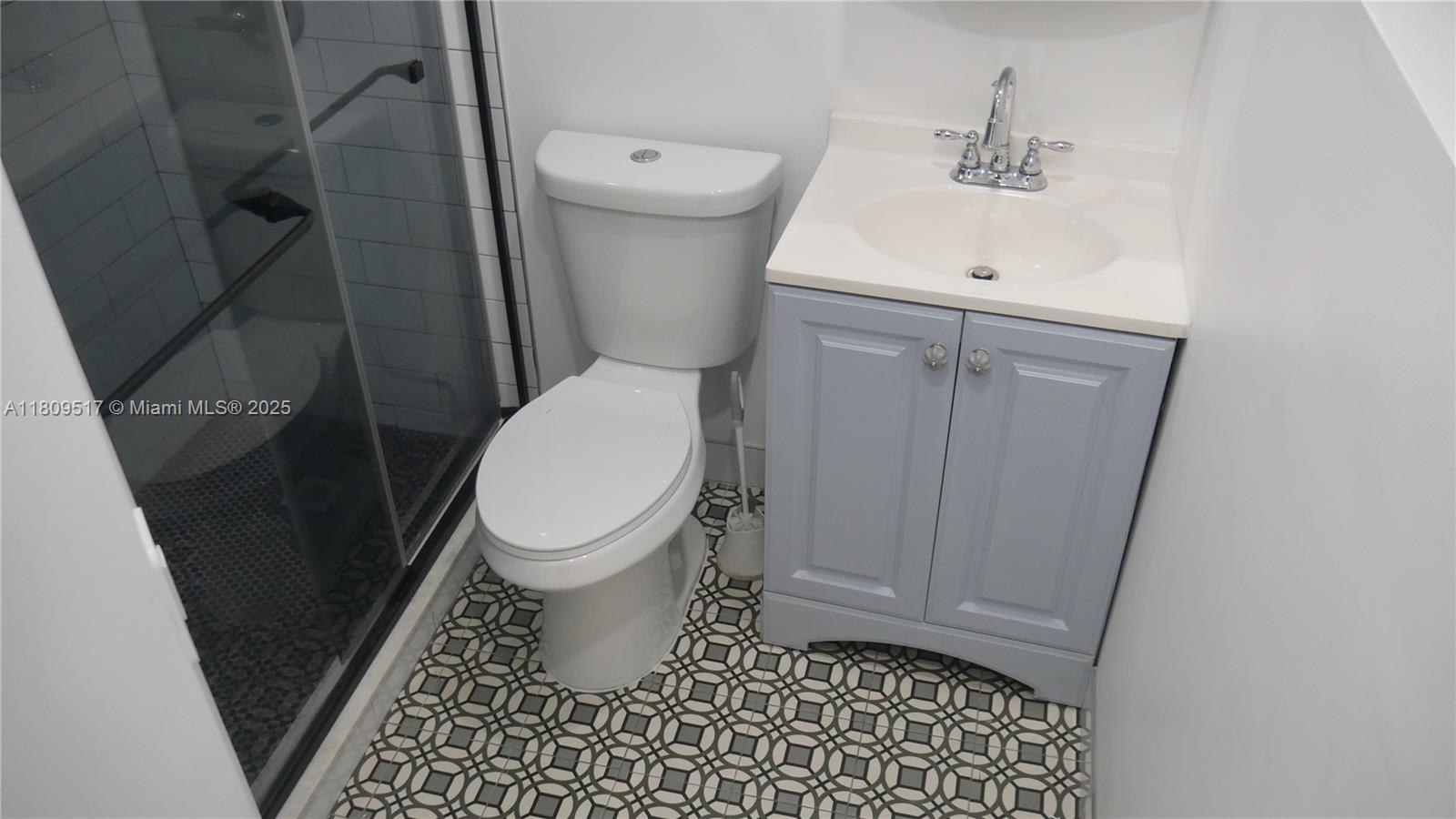 1930 Northwest 55th Street Miami, FL 33142 - Photo 11 of 30 a bathroom with a toilet and a sink