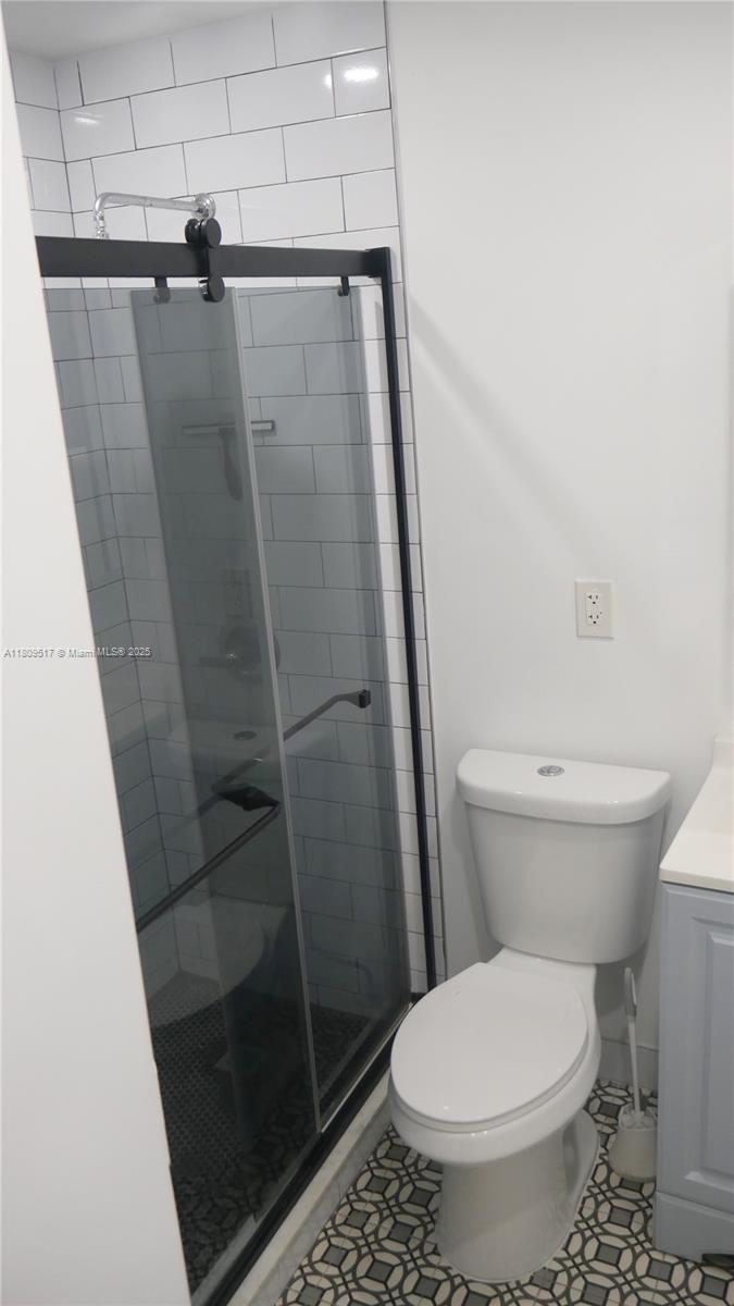 1930 Northwest 55th Street Miami, FL 33142 - Photo 12 of 30 a bathroom with a toilet and a shower