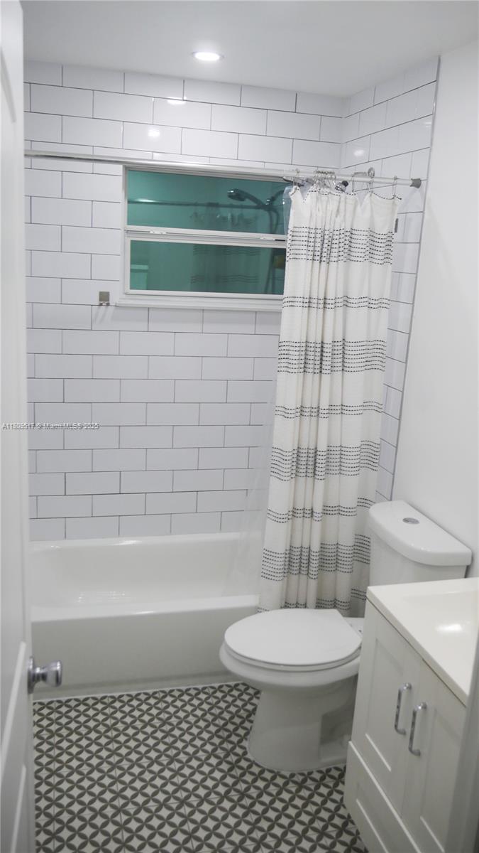 1930 Northwest 55th Street Miami, FL 33142 - Photo 18 of 30 a bathroom with a toilet and a shower