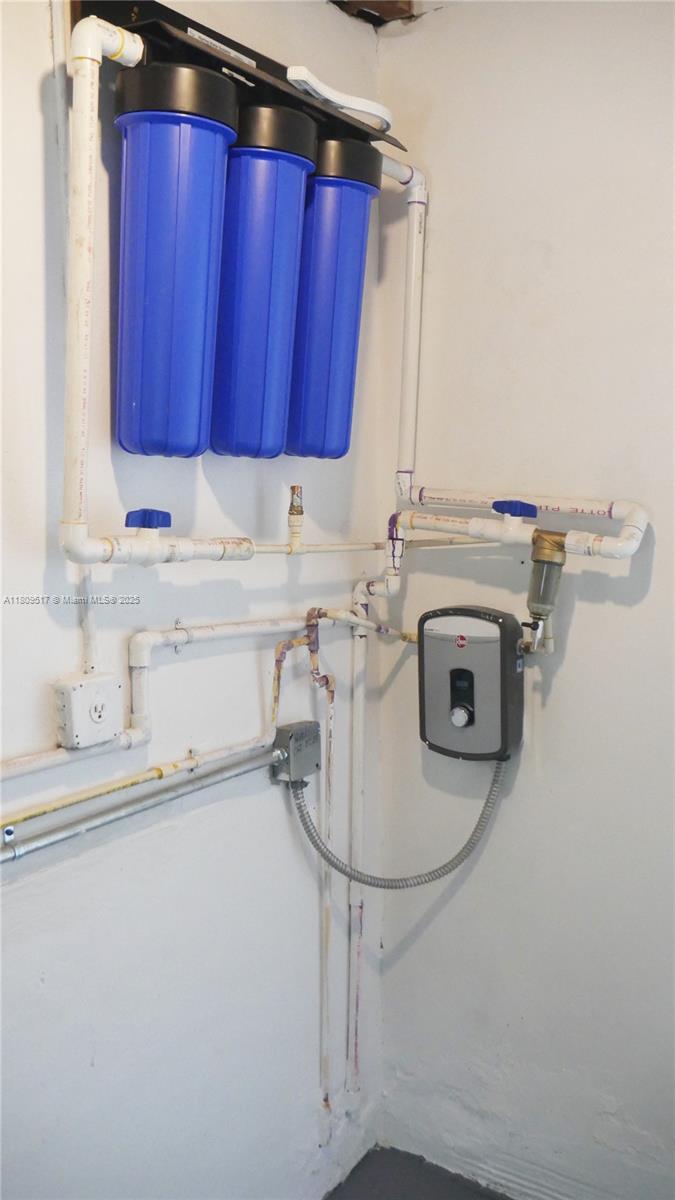 1930 Northwest 55th Street Miami, FL 33142 - Photo 27 of 30 a utility room with dryer and washer