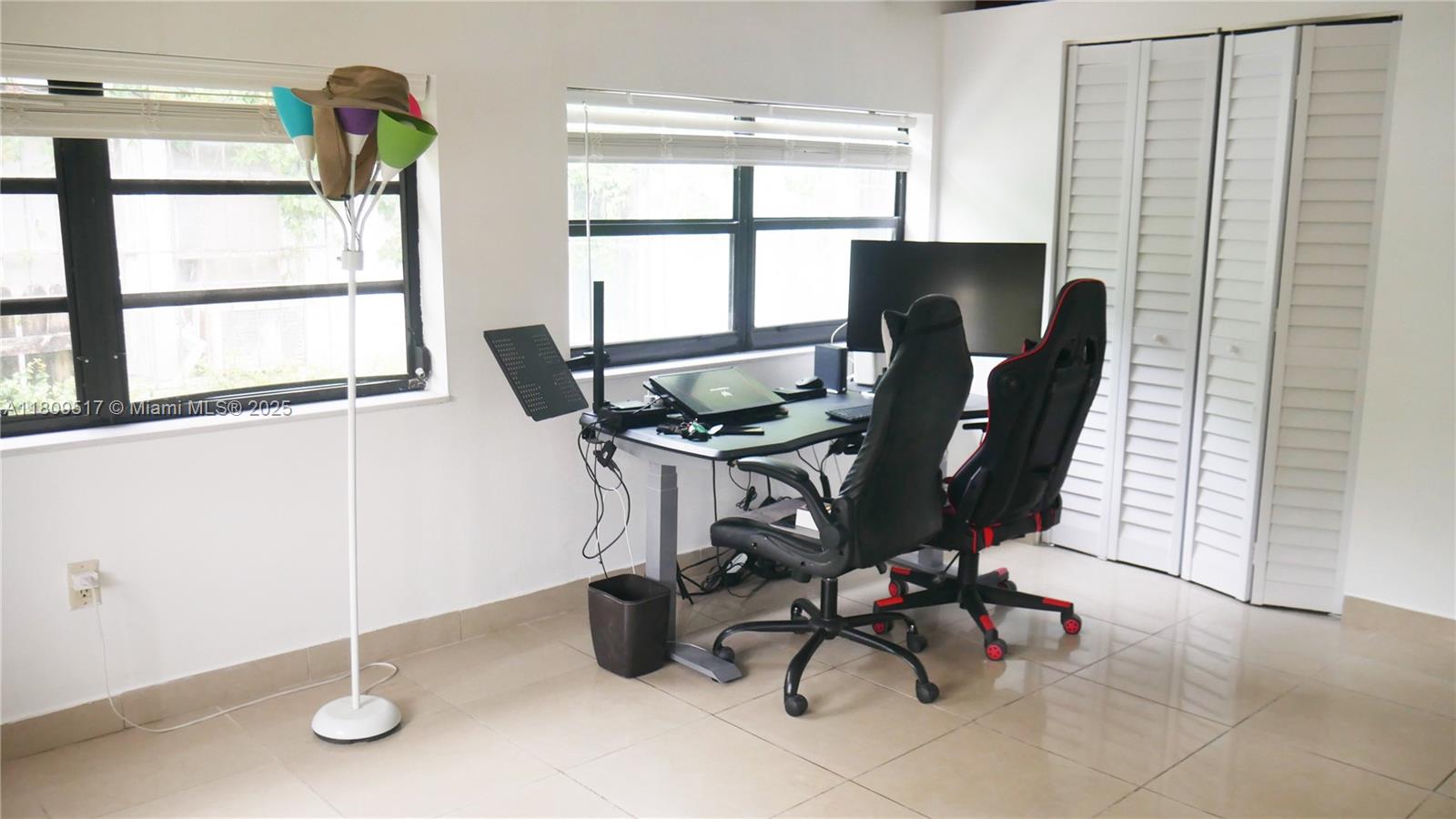 1930 Northwest 55th Street Miami, FL 33142 - Photo 8 of 30 a view of a workspace with furniture and a window