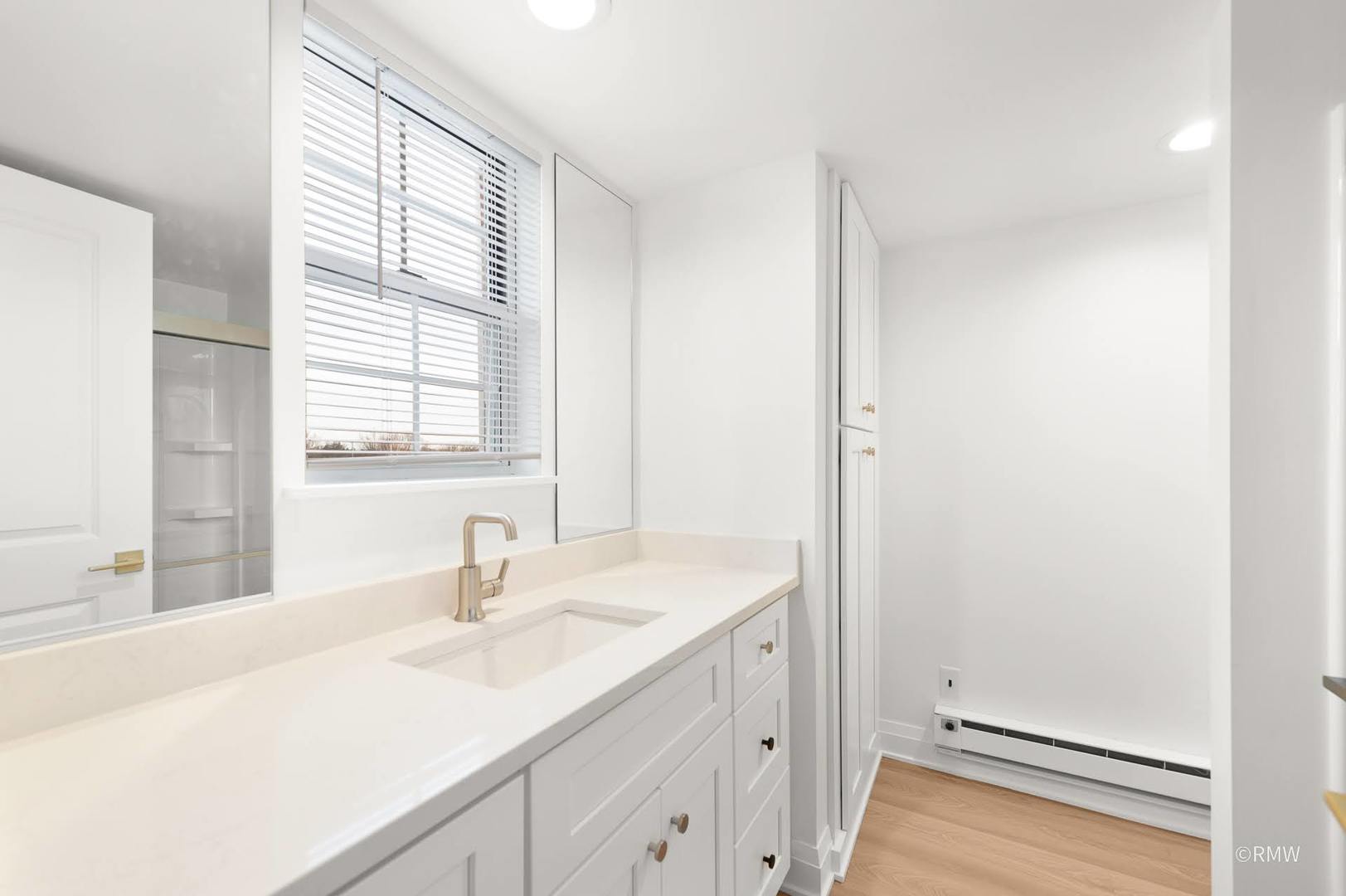 224 South Rush Street, Unit 3A Itasca, IL 60143 - Photo 12 of 13 a bathroom with a sink and a window