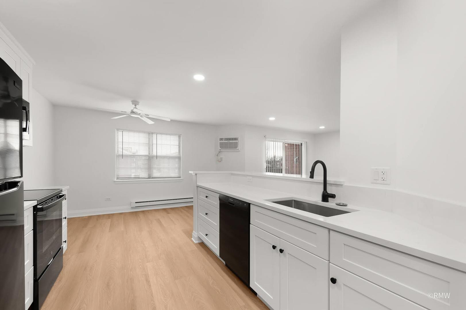 224 South Rush Street, Unit 3A Itasca, IL 60143 - Photo 2 of 13 a kitchen with a sink stainless steel appliances and window