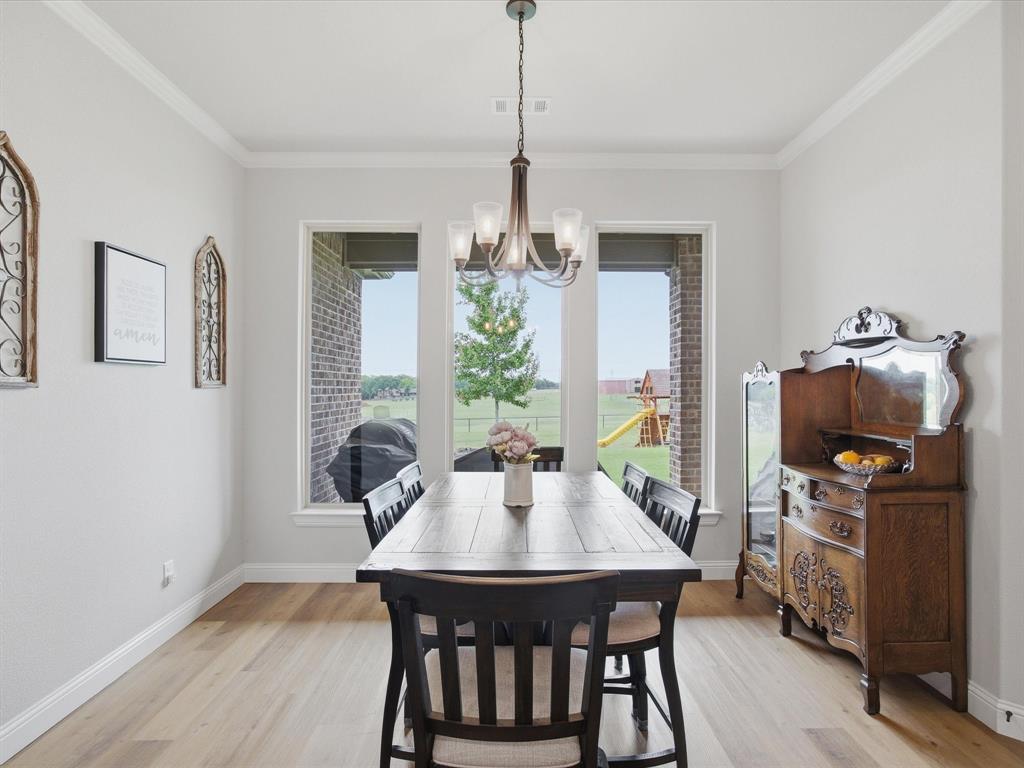150 Quail Ridge Decatur, TX 76234 - Photo 16 of 32 a view of a dining room with furniture window and wooden floor