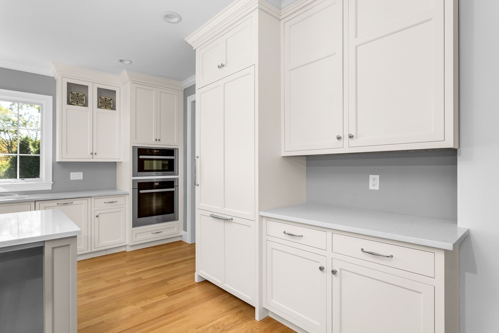 216 Oak Street Westwood, MA 02090 - Photo 19 of 37 a kitchen with stainless steel appliances granite countertop a refrigerator and cabinets