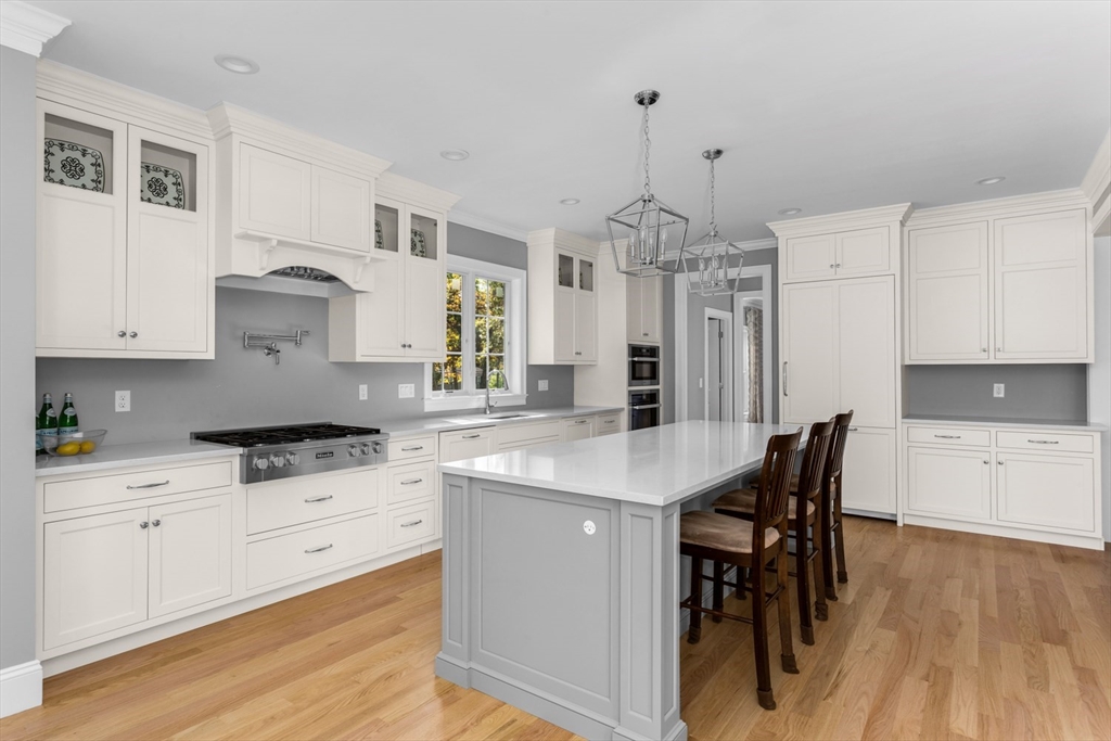 216 Oak Street Westwood, MA 02090 - Photo 21 of 37 a kitchen with granite countertop white cabinets and white appliances