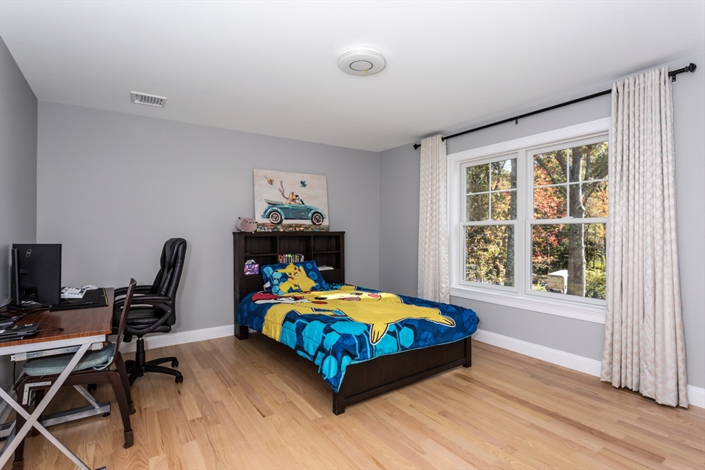 216 Oak Street Westwood, MA 02090 - Photo 23 of 37 a bedroom with a bed and a desk