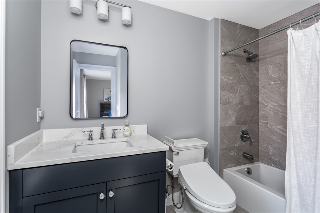 216 Oak Street Westwood, MA 02090 - Photo 24 of 37 a bathroom with a sink toilet and shower