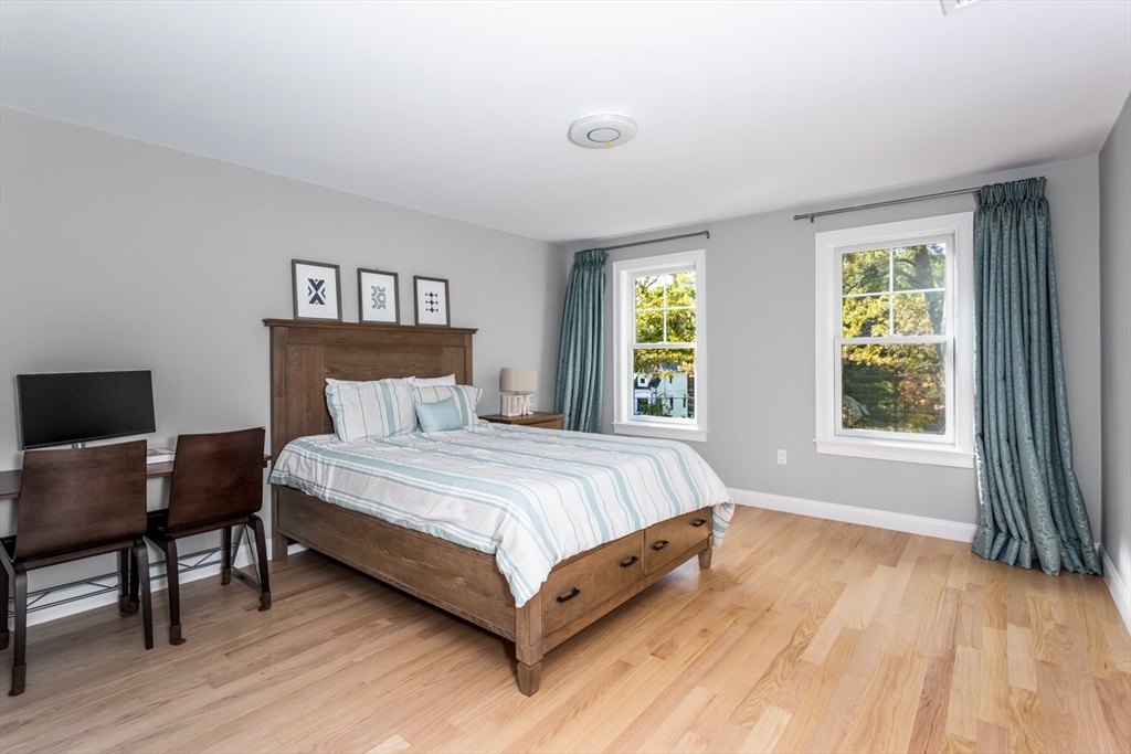 216 Oak Street Westwood, MA 02090 - Photo 25 of 37 a spacious bedroom with a bed and a window