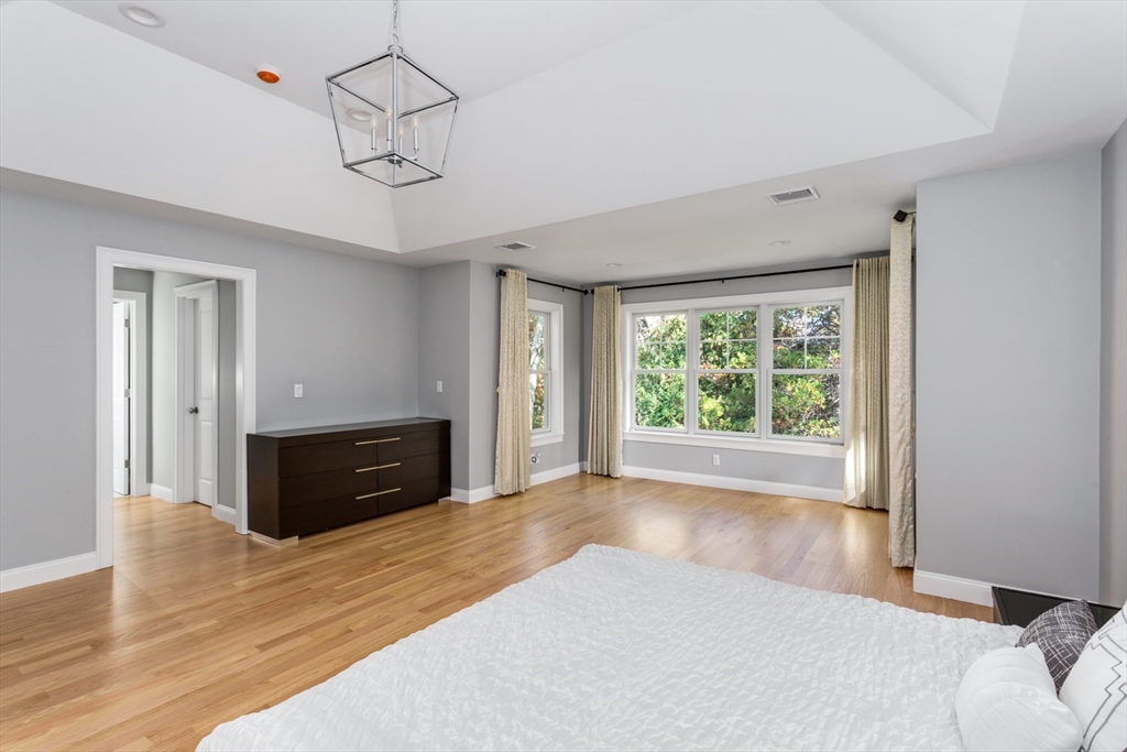 216 Oak Street Westwood, MA 02090 - Photo 32 of 37 a room with a bed and a dresser