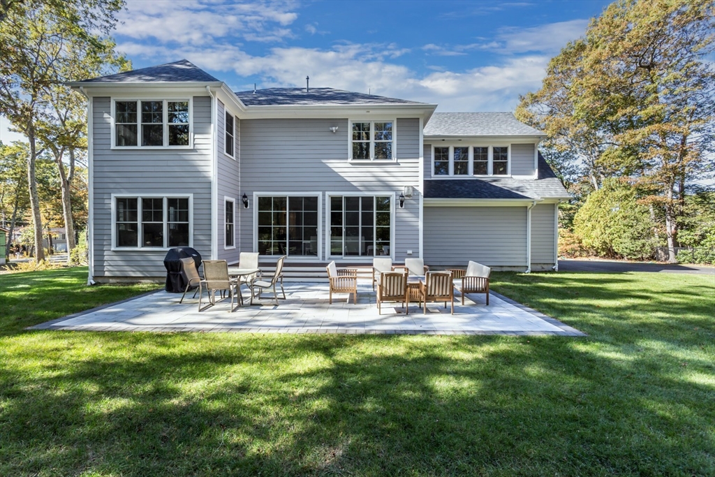 216 Oak Street Westwood, MA 02090 - Photo 4 of 37 a view of a house with a yard and sitting area