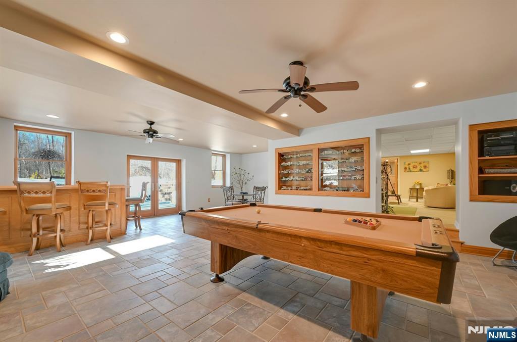 285 Chestnut Ridge Road Woodcliff Lake, NJ 07677 - Photo 44 of 46 a room with pool table and windows