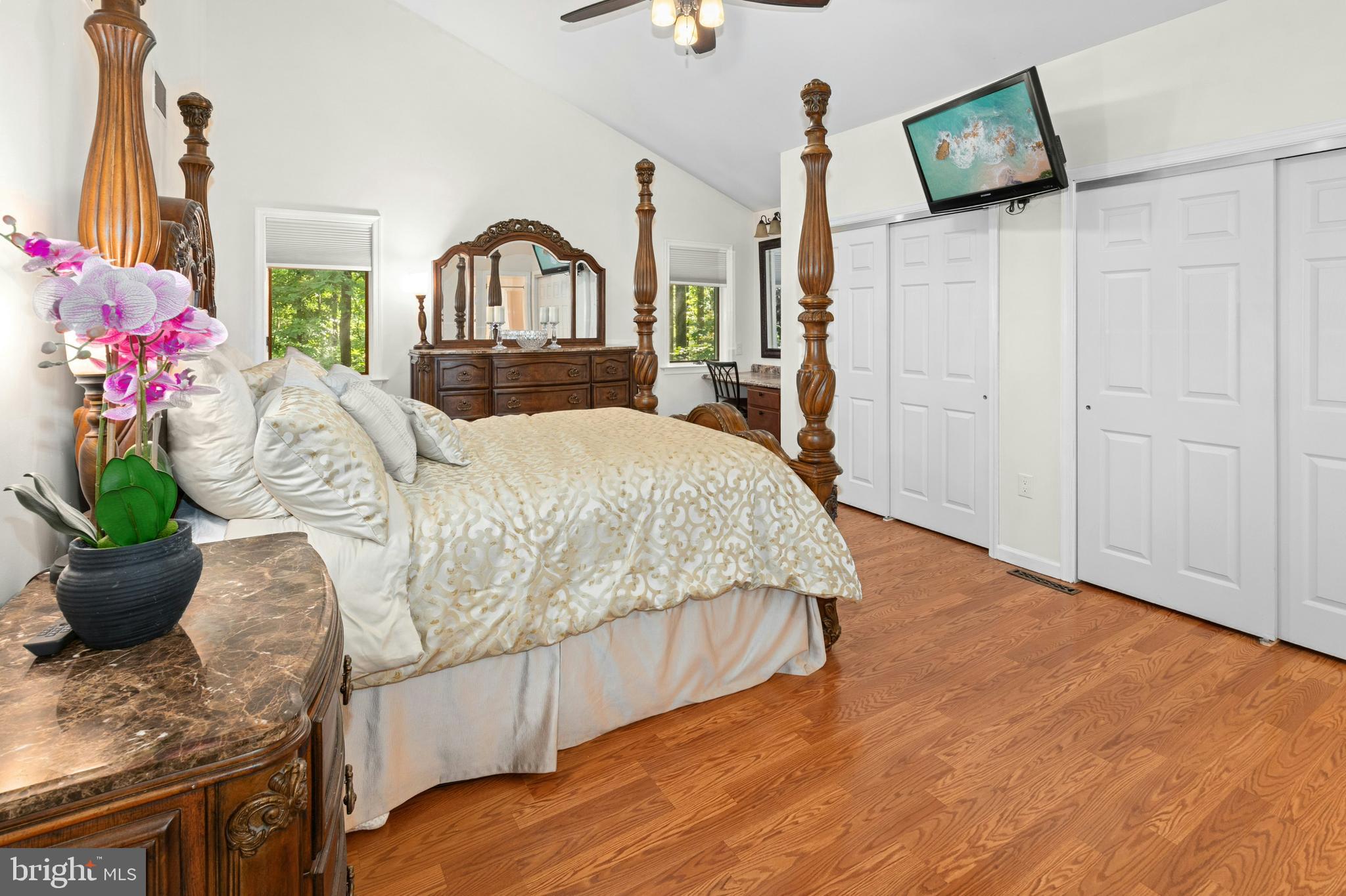 1715 Kumry Road Quakertown, PA 18951 - Photo 20 of 37 a spacious bedroom with a bed a window and potted plant on table