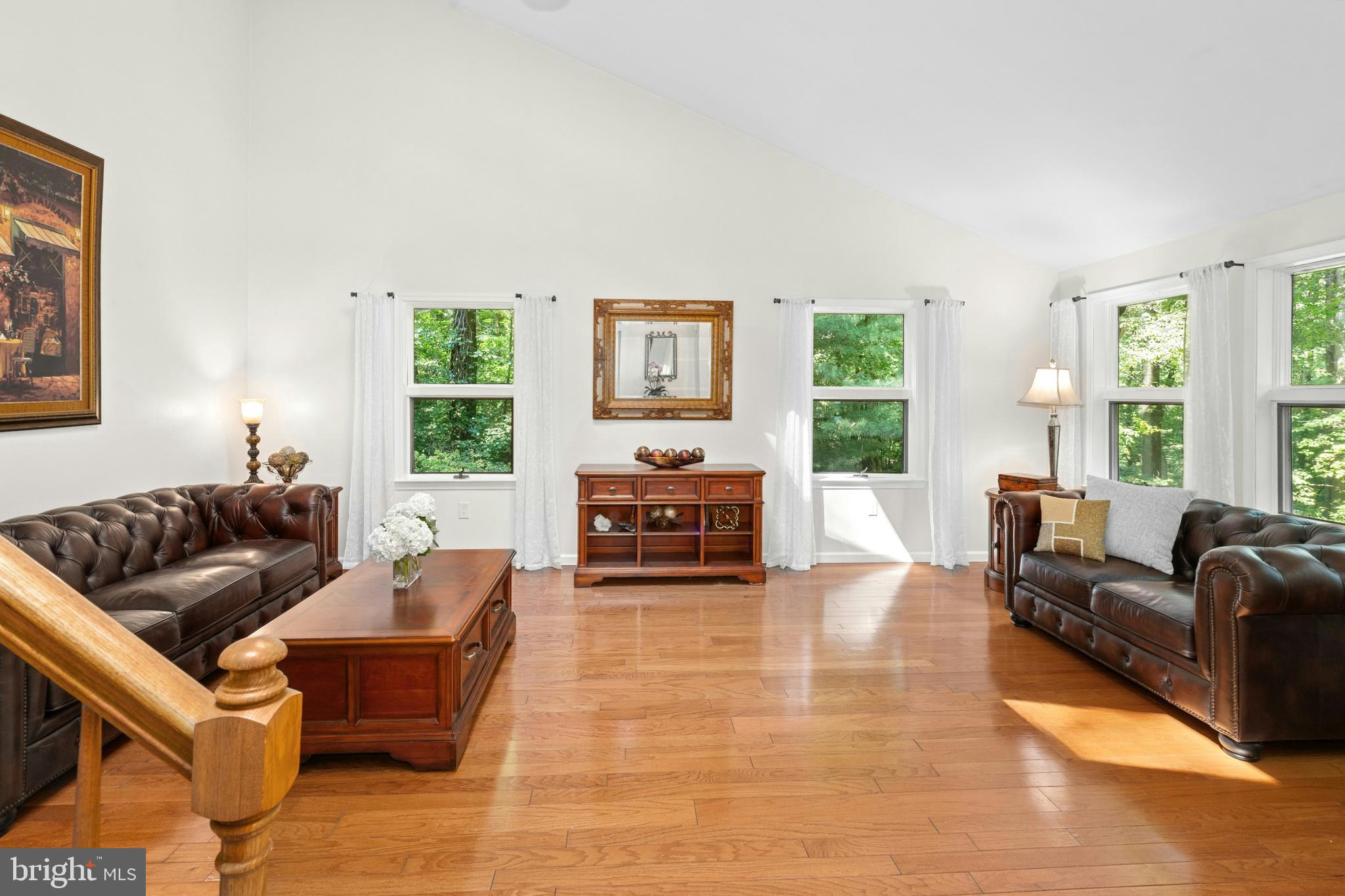 1715 Kumry Road Quakertown, PA 18951 - Photo 6 of 37 a living room with fireplace furniture and large windows