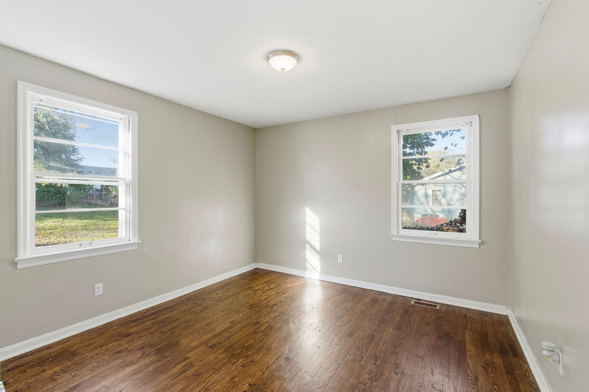 705 Pace Street Gallatin, TN 37066 - Photo 13 of 21 a view of an empty room with wooden floor and a window