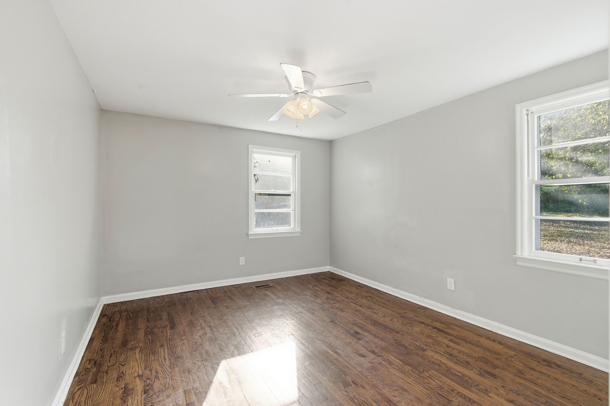705 Pace Street Gallatin, TN 37066 - Photo 16 of 21 an empty room with wooden floor fan and windows