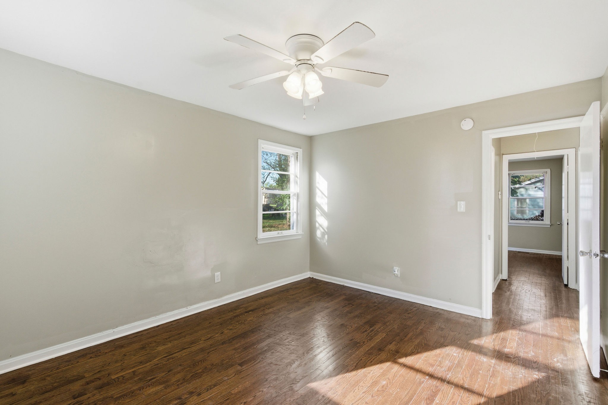 705 Pace Street Gallatin, TN 37066 - Photo 18 of 21 wooden floor in an empty room with a window