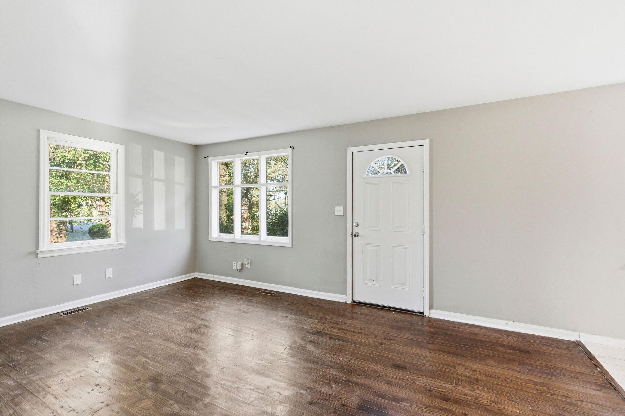 705 Pace Street Gallatin, TN 37066 - Photo 2 of 21 a view of an empty room with wooden floor and a window