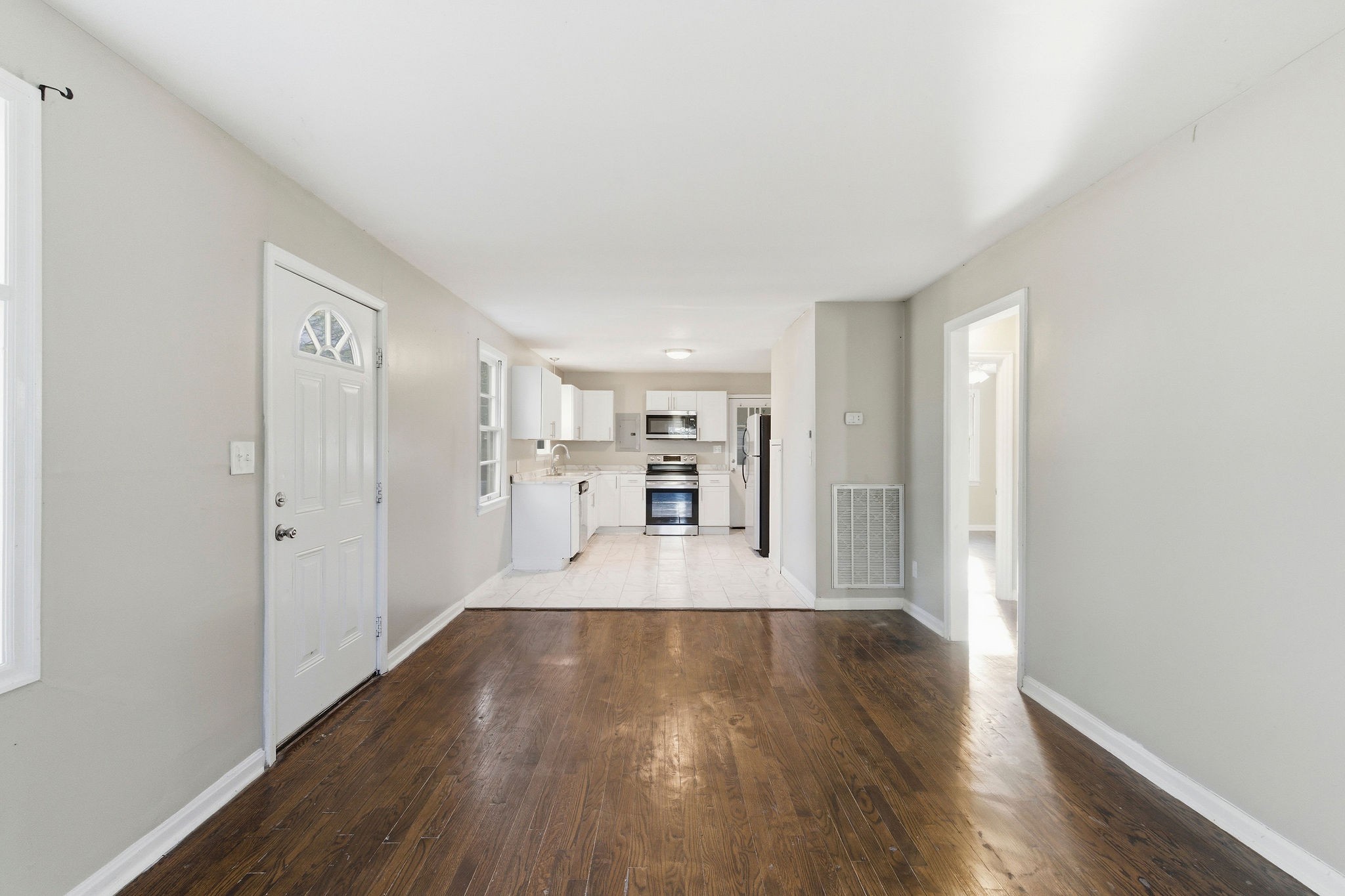 705 Pace Street Gallatin, TN 37066 - Photo 4 of 21 a view of a kitchen with wooden floor and a window