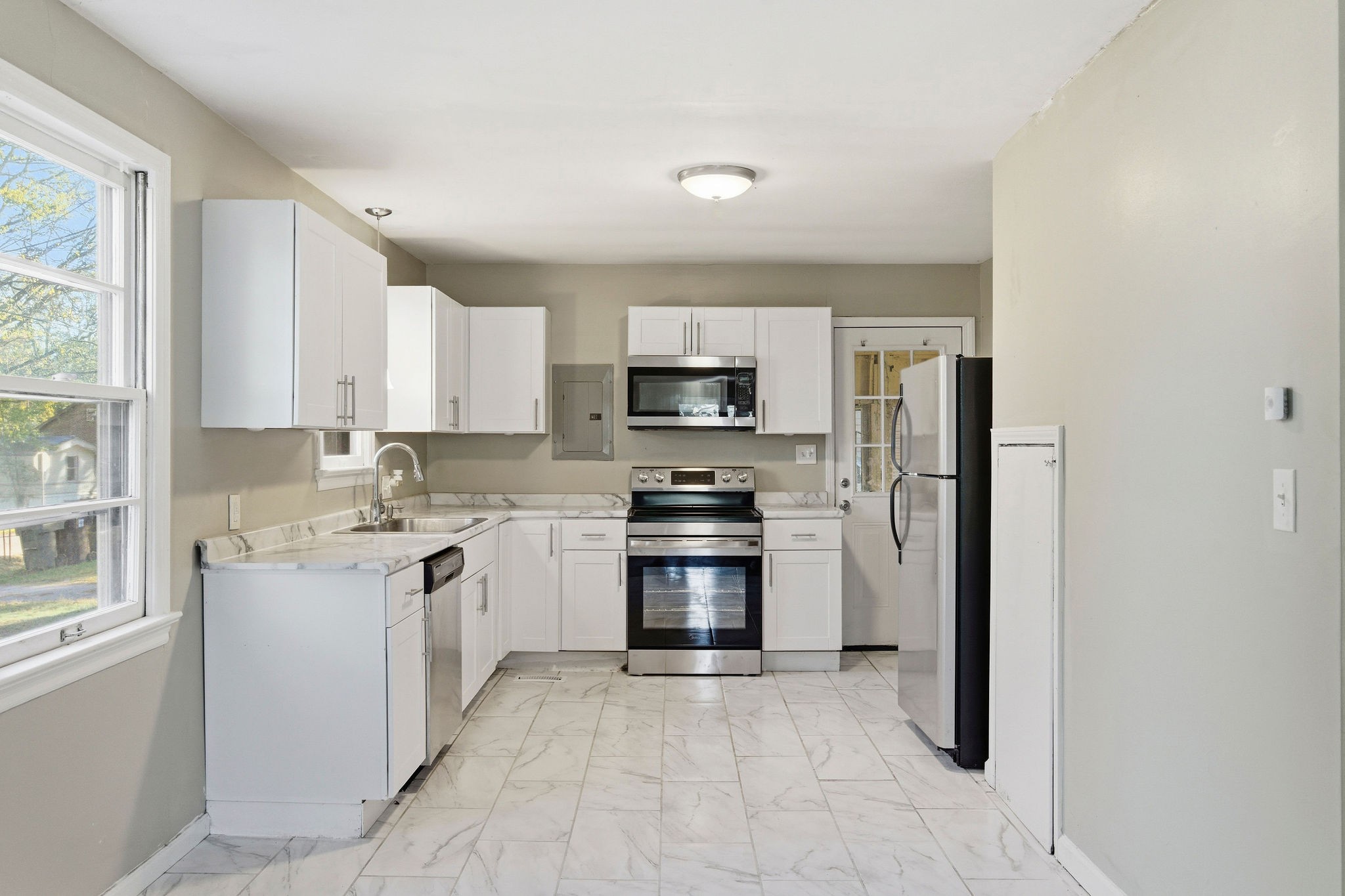 705 Pace Street Gallatin, TN 37066 - Photo 5 of 21 a kitchen with a sink stove and refrigerator