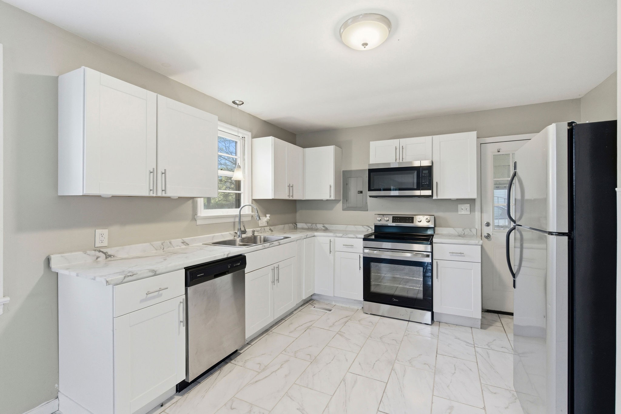 705 Pace Street Gallatin, TN 37066 - Photo 6 of 21 a kitchen with a sink stove and refrigerator