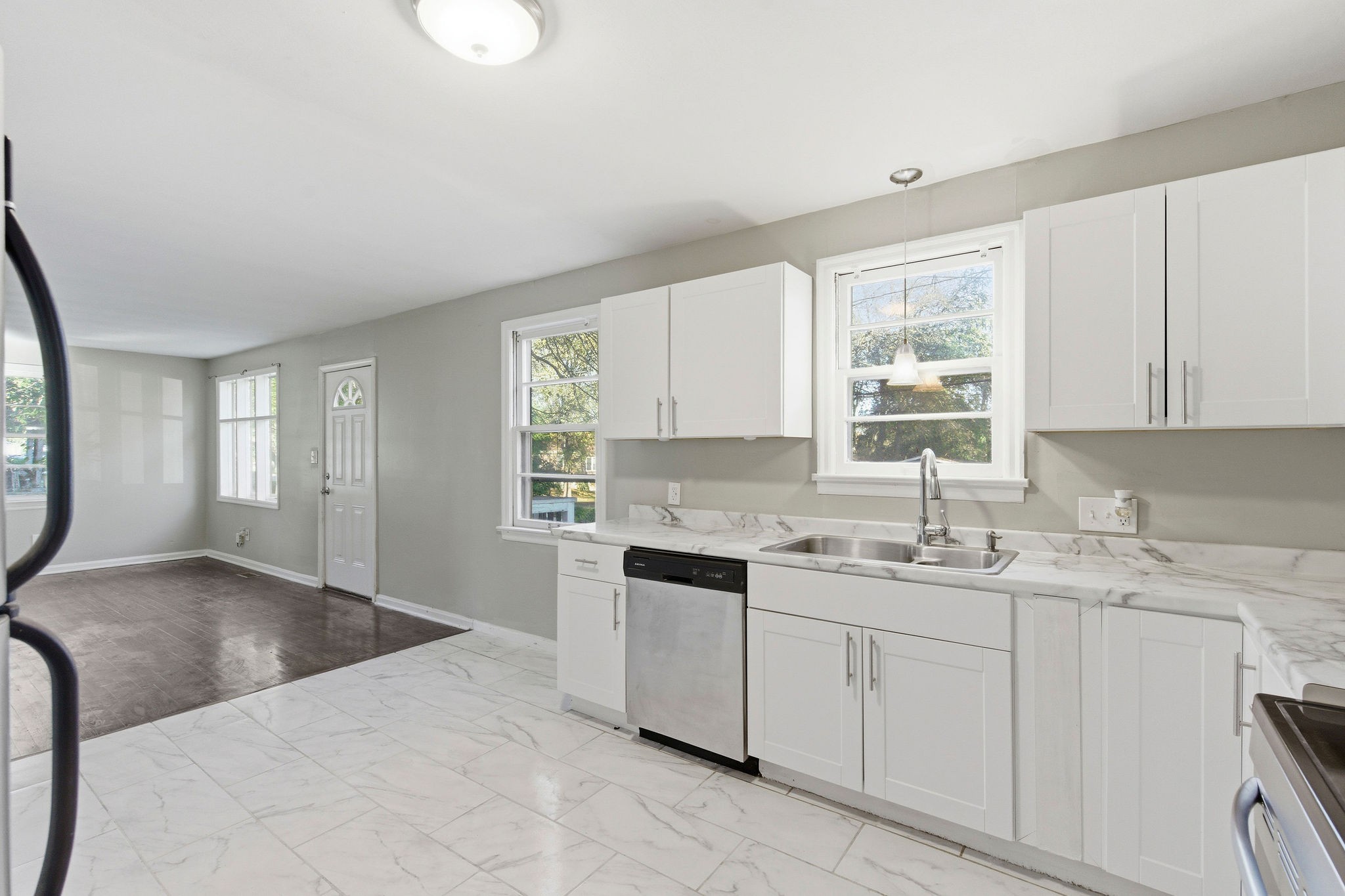 705 Pace Street Gallatin, TN 37066 - Photo 7 of 21 a kitchen with a sink window and cabinets