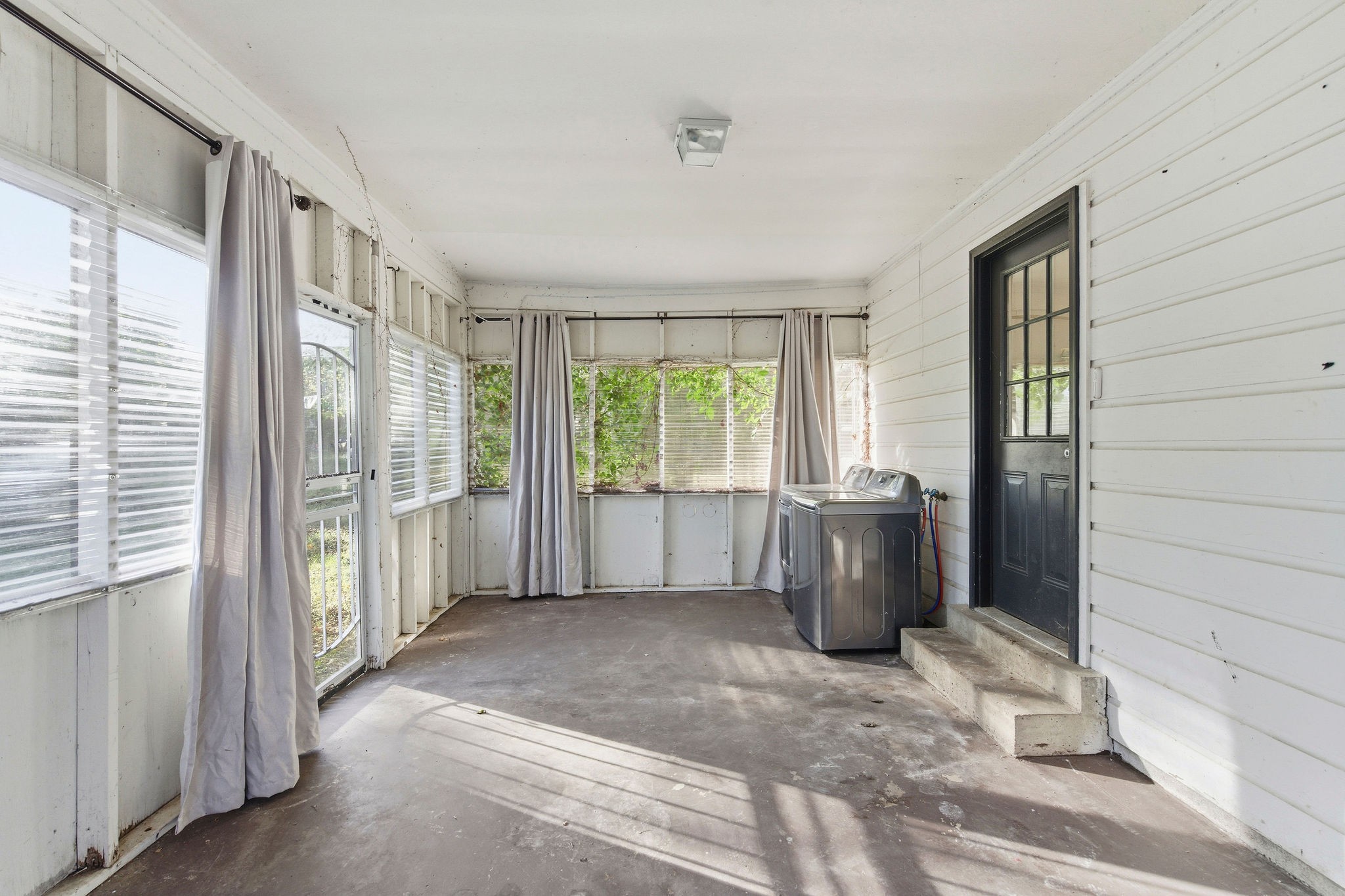 705 Pace Street Gallatin, TN 37066 - Photo 9 of 21 a living room with furniture and a floor to ceiling window