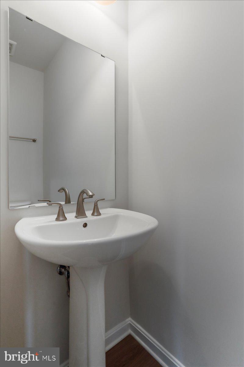 62 Peters Avenue Ranson, WV 25438 - Photo 16 of 31 a close up of a sink and mirror