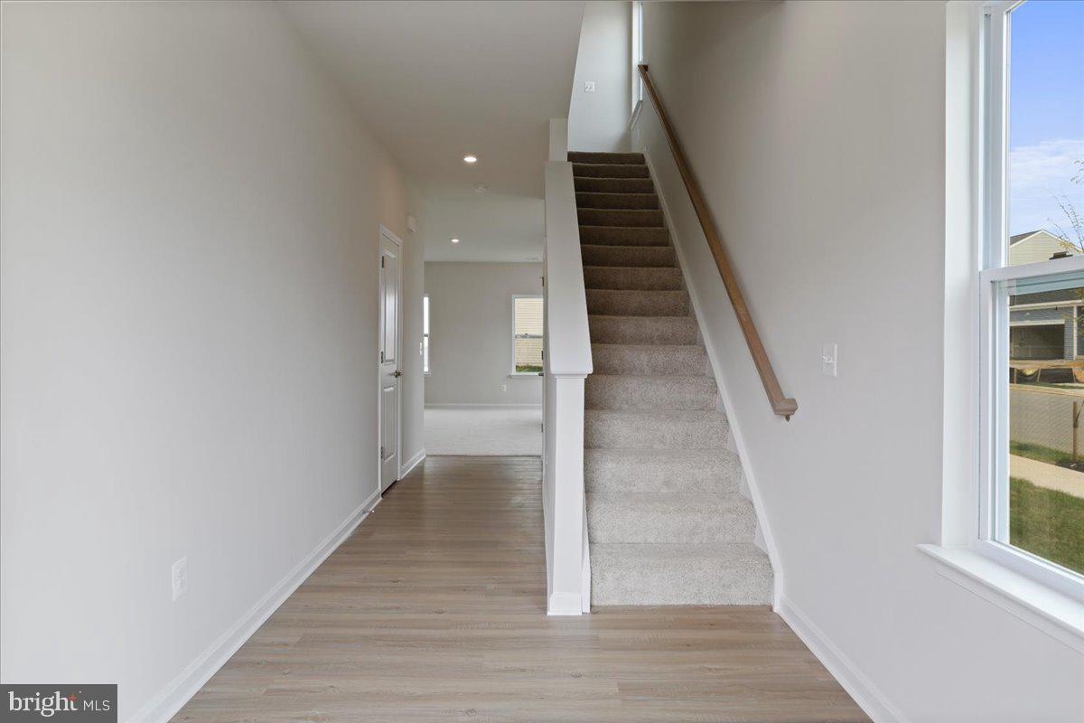 62 Peters Avenue Ranson, WV 25438 - Photo 17 of 31 a view of entryway and hall with wooden floor