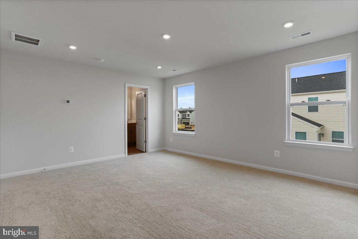 62 Peters Avenue Ranson, WV 25438 - Photo 20 of 31 an empty room with windows and closet