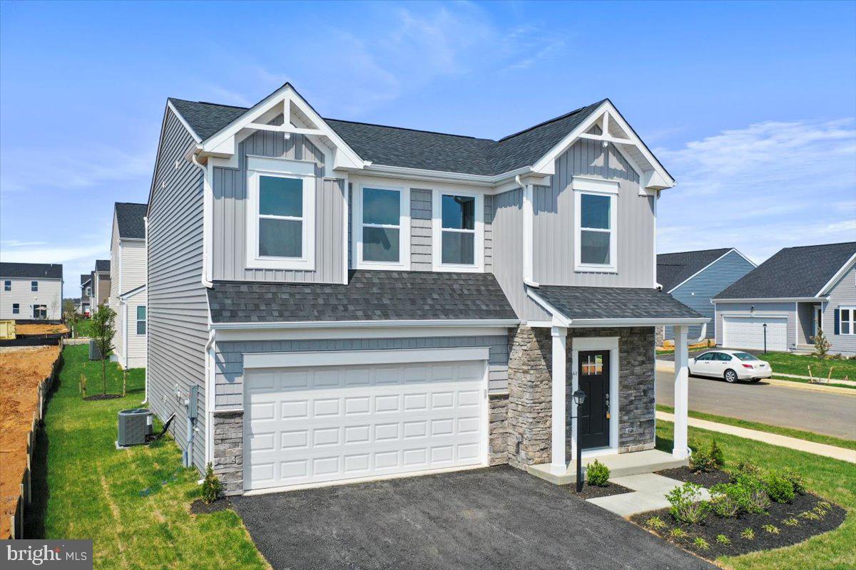 62 Peters Avenue Ranson, WV 25438 - Photo 2 of 31 a front view of a house with a yard