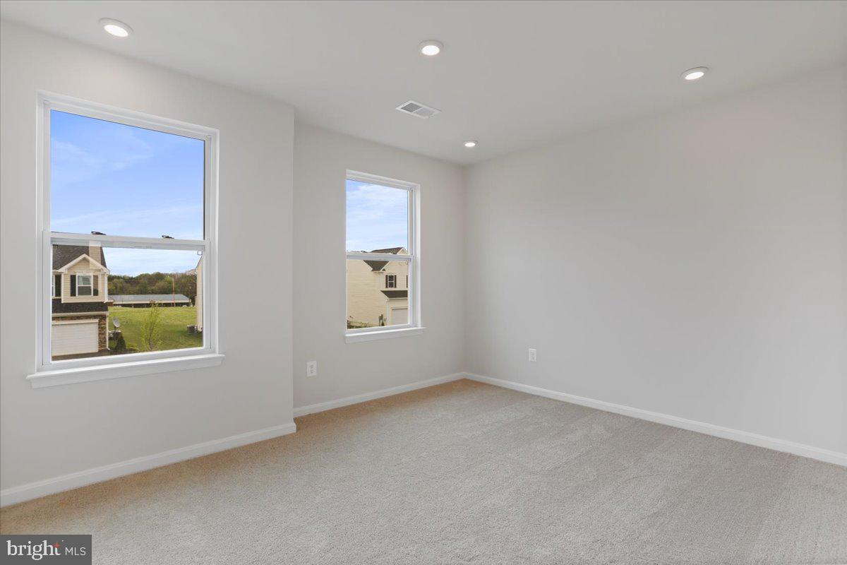 62 Peters Avenue Ranson, WV 25438 - Photo 27 of 31 an empty room with windows