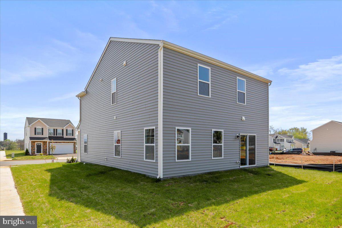 62 Peters Avenue Ranson, WV 25438 - Photo 30 of 31 a front view of a house with a garden