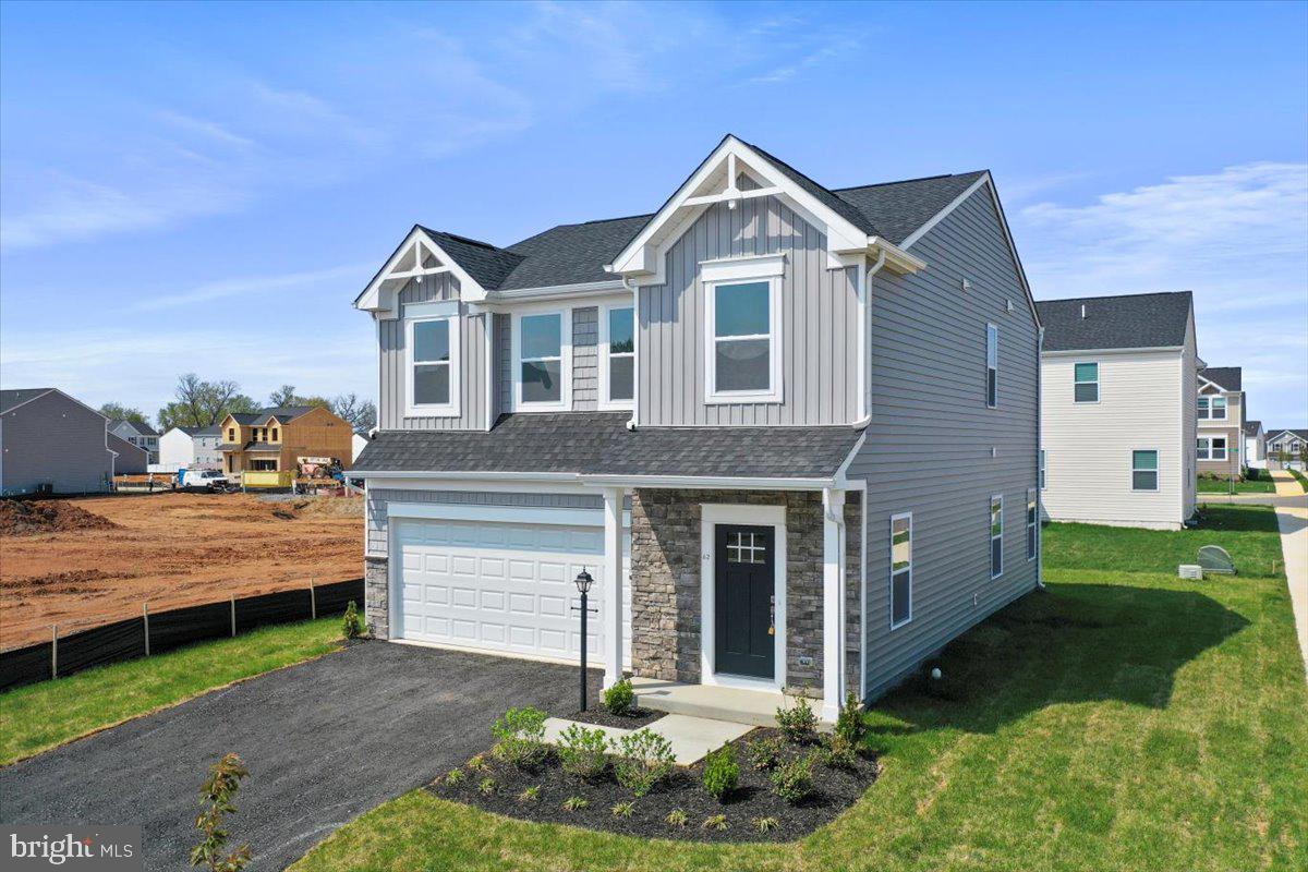62 Peters Avenue Ranson, WV 25438 - Photo 31 of 31 a front view of a house with a yard